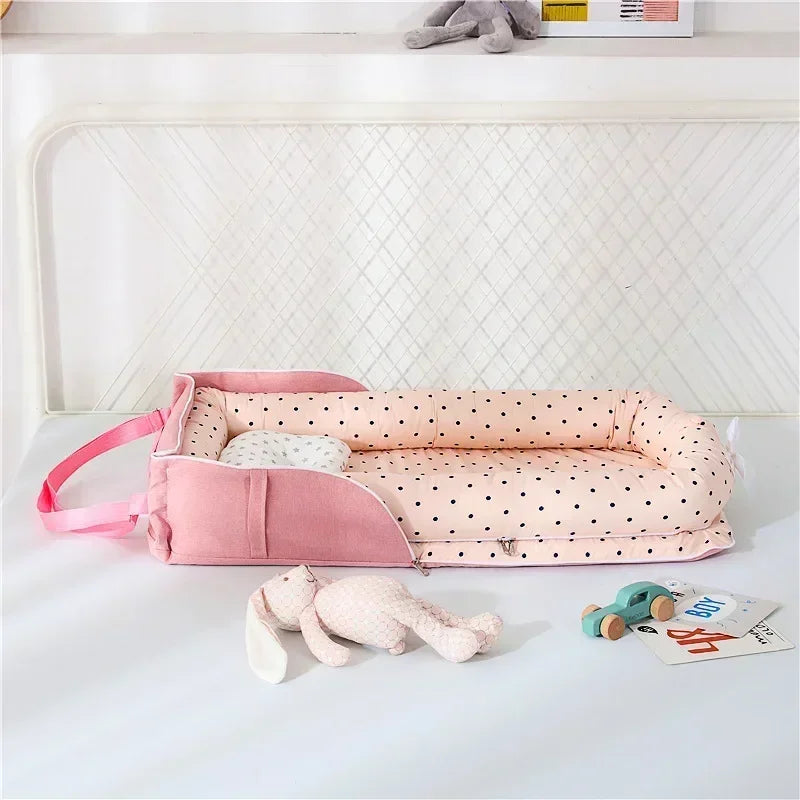 nid-pour-bébé-rose-picoté-rose-polyvalent