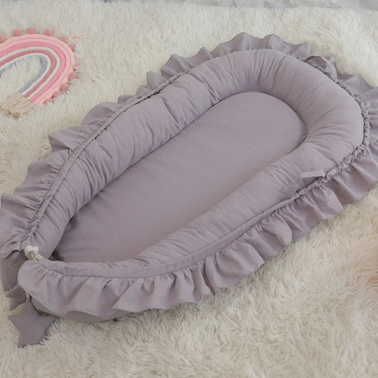 réducteur-de-lit-bébé-gris-design-unique