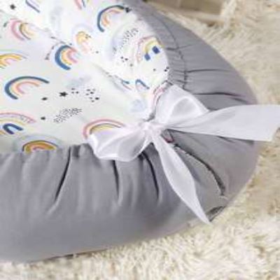 reducteur-de-lit-bebe-nidportablebebe-arc-en-ciel-confortable-et-durable