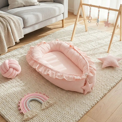 réducteur-de-lit-bébé-rose-design-harmonieux