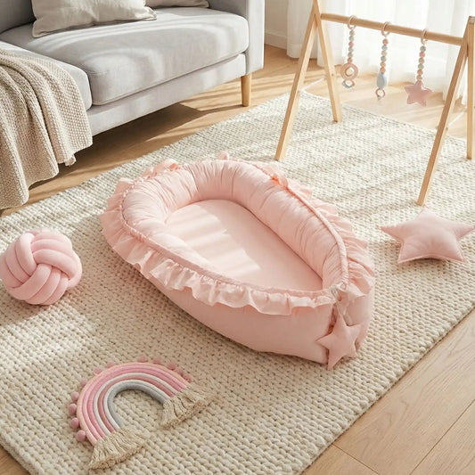 réducteur-de-lit-bébé-rose-design-harmonieux