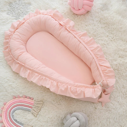 réducteur-de-lit-bébé-rose-design-unique